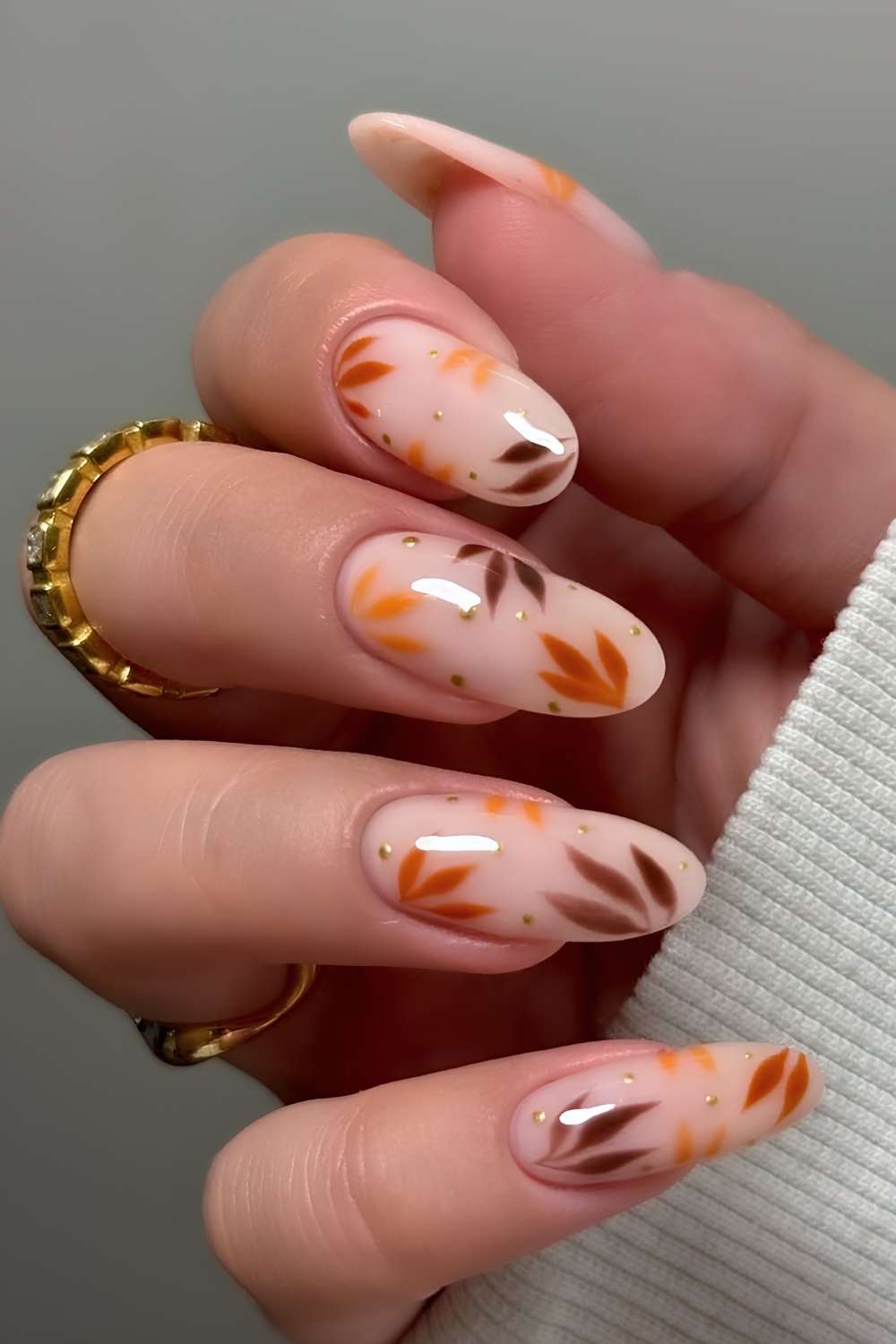 Milky white nails with fall leaf art