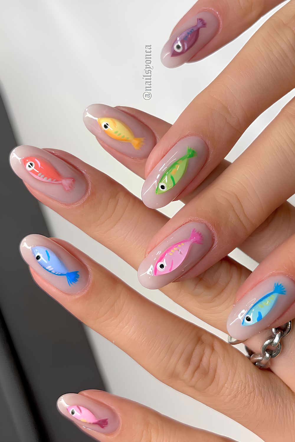 Milky white nails with fish art
