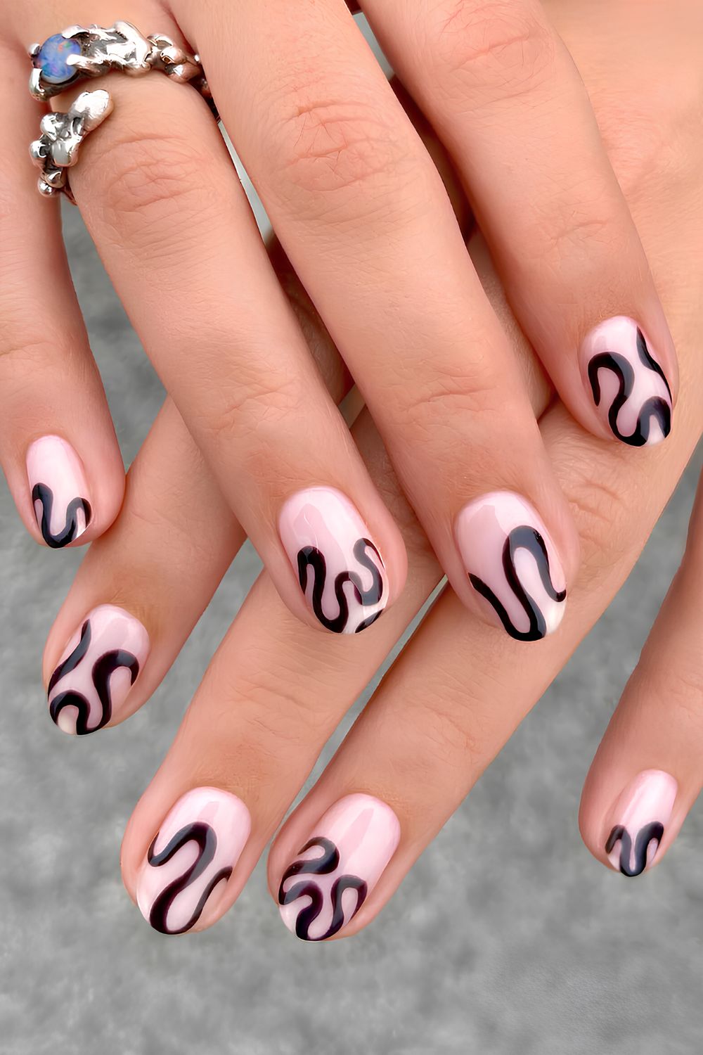 Milky white nails with funky black swirls