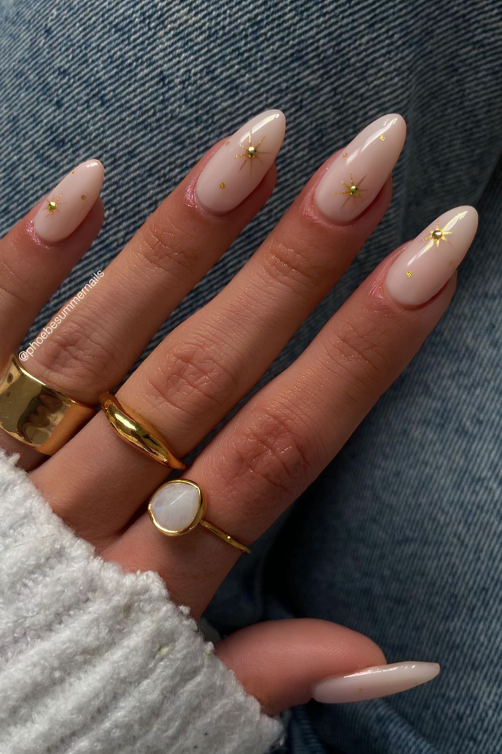 Milky white nails with gold celestial accents