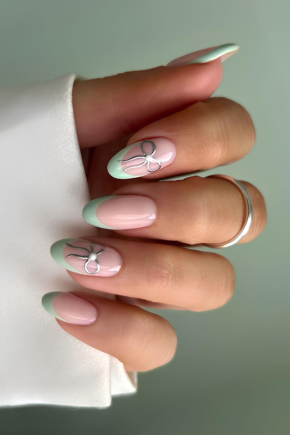 Mint green French nails with bows