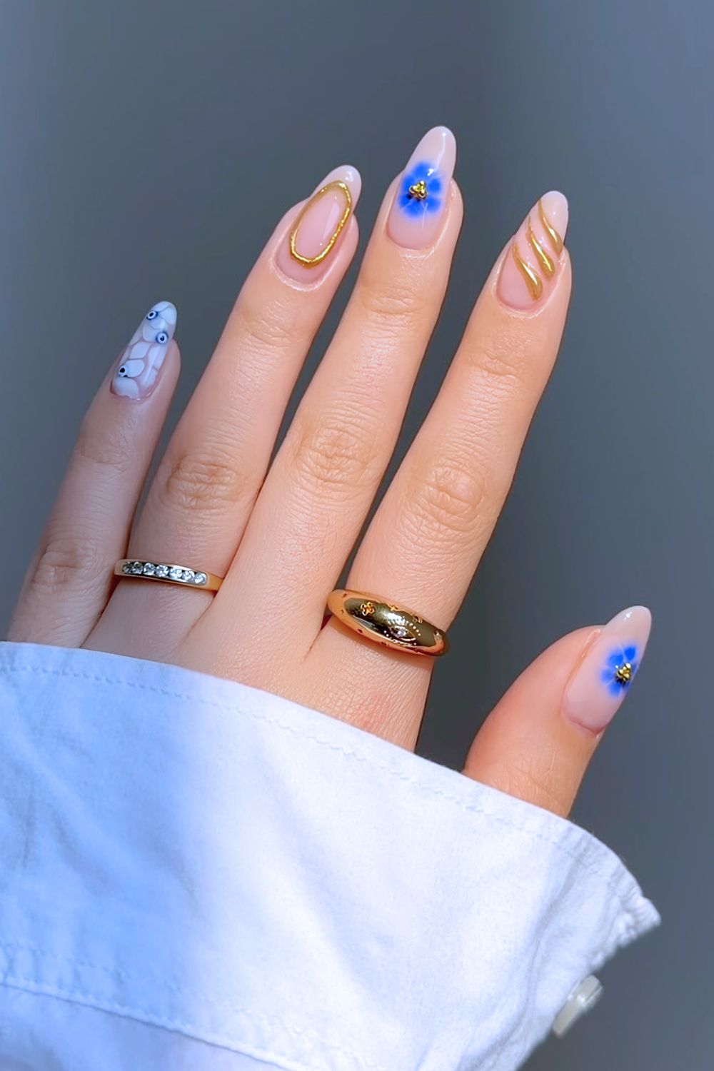 Mix and match evil eye nail design