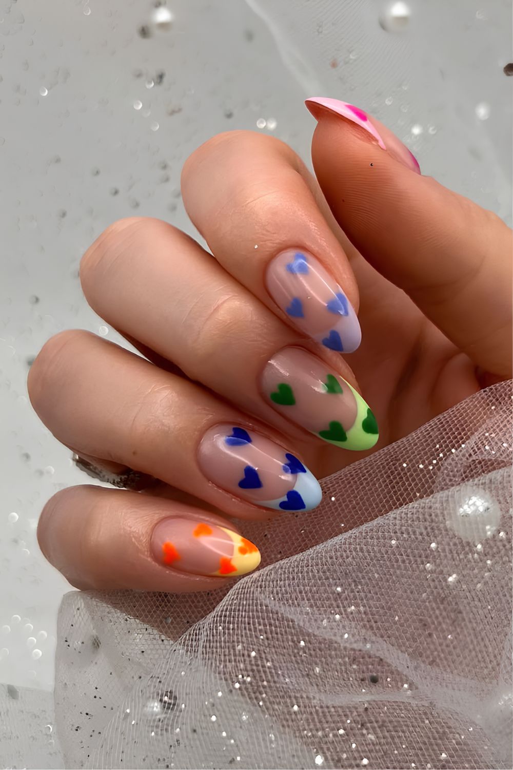 Multicolored French tips with matching heart design