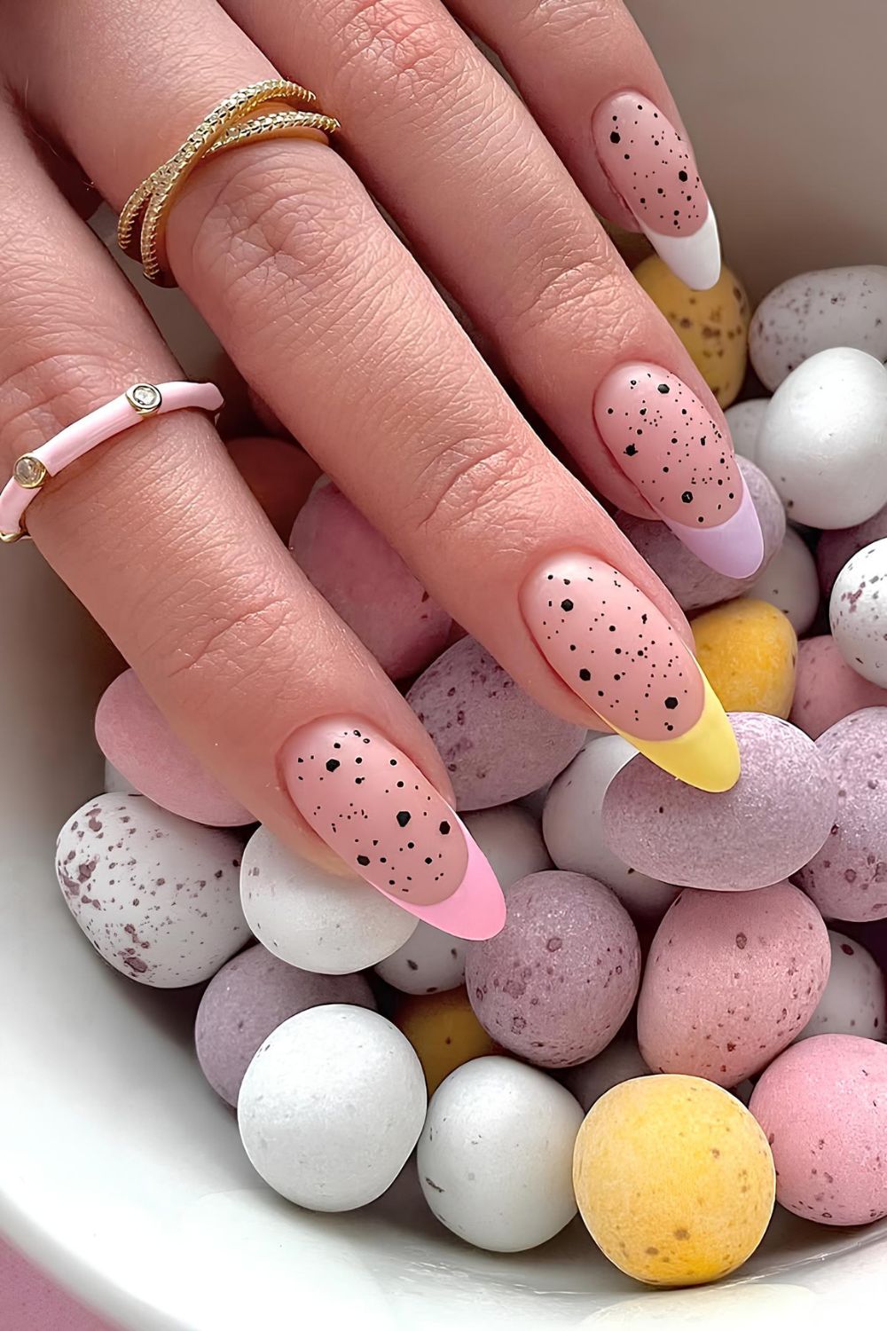 Multicolored pastel French manicure with speckles