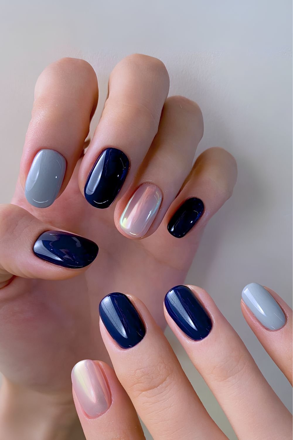 Navy blue and gray nails with chrome accents