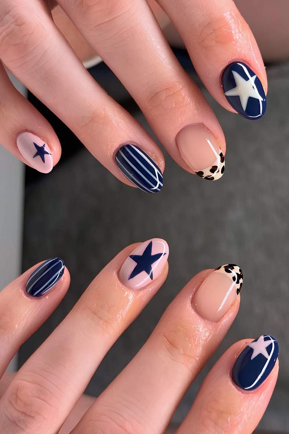 Navy blue nails with stars and animal print