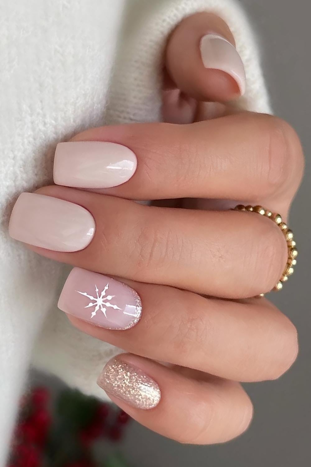 Neutral Christmas nails with glitter and snowflakes