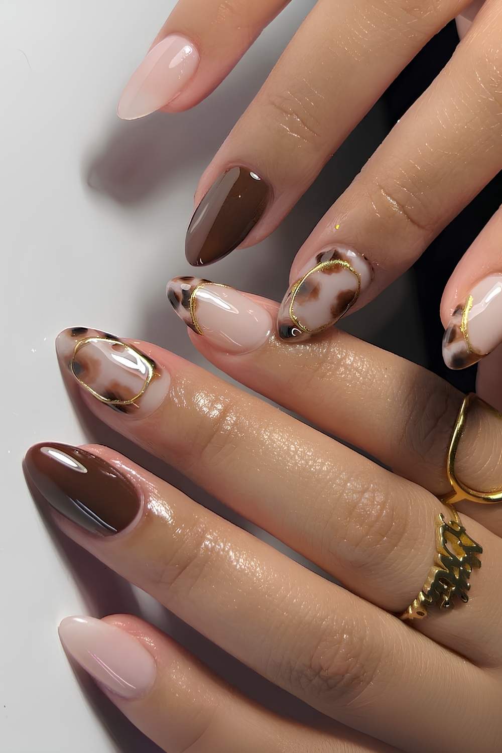 Neutral and brown nails with tortie shell accents