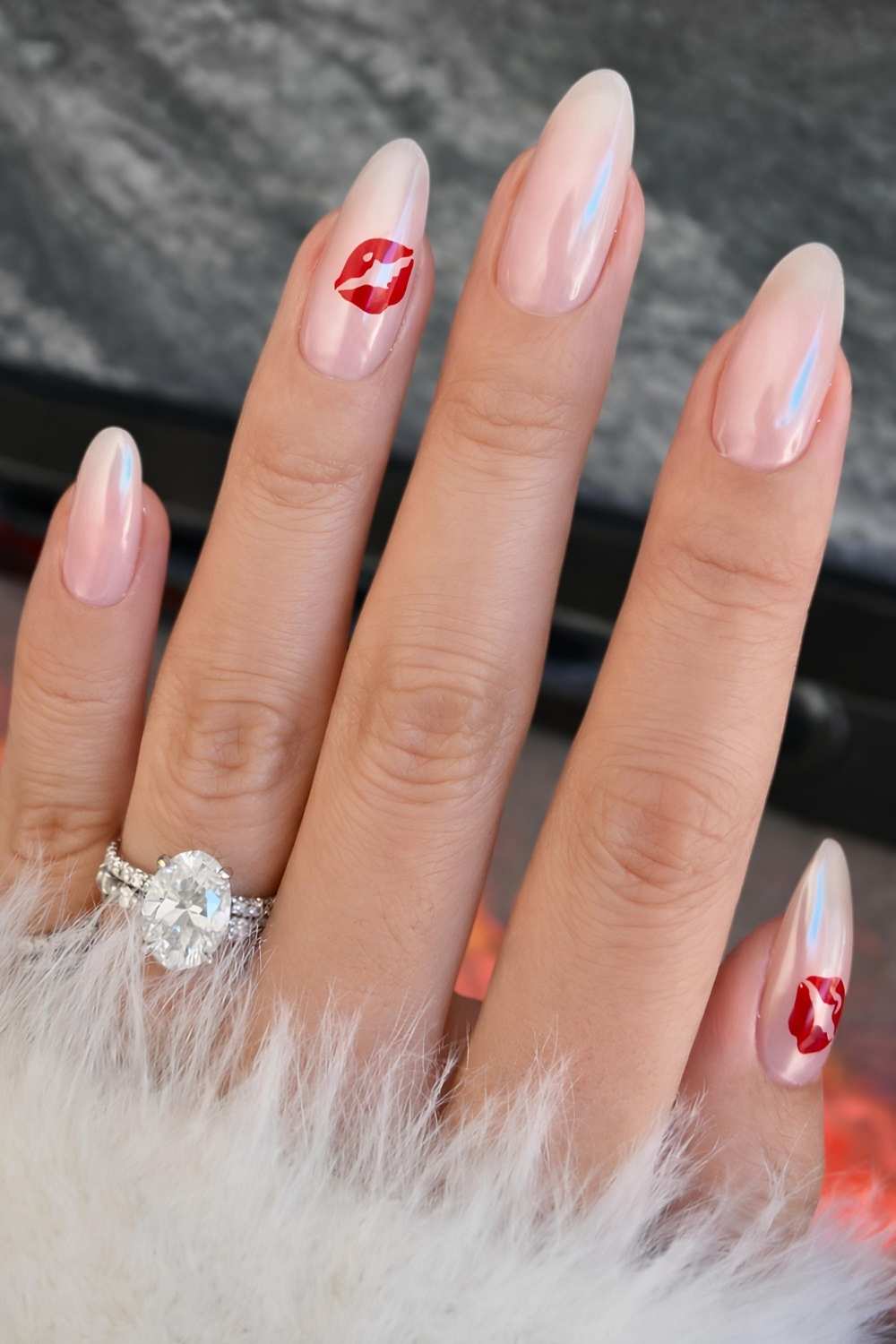 Neutral chrome nails with red kiss art