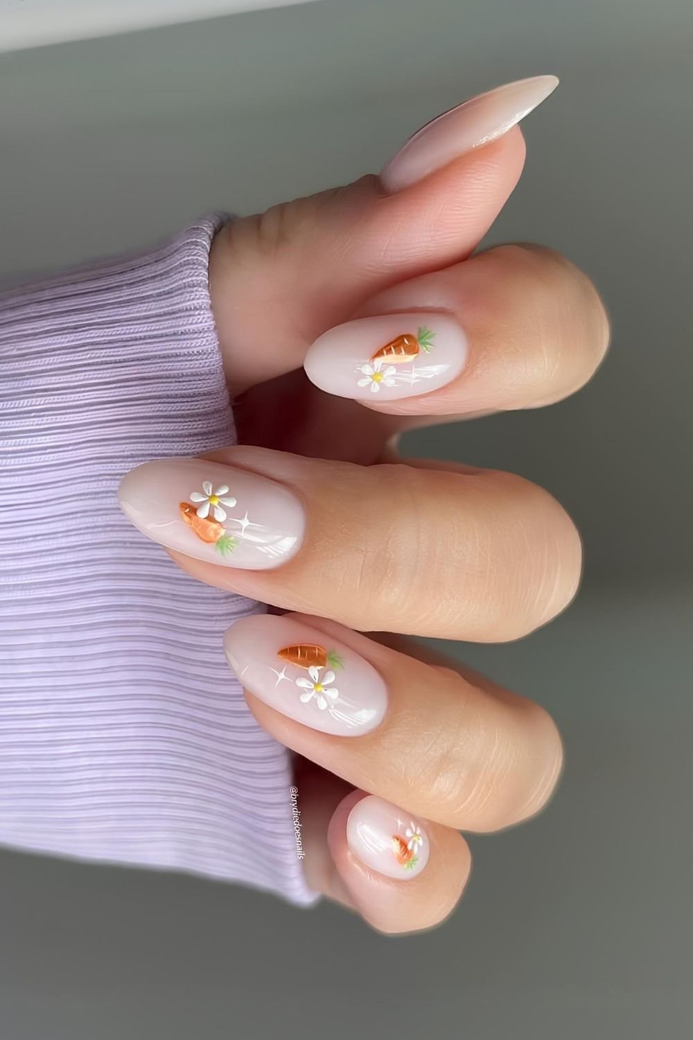 Neutral milky nails with chrome carrots daisies and starburst nail art