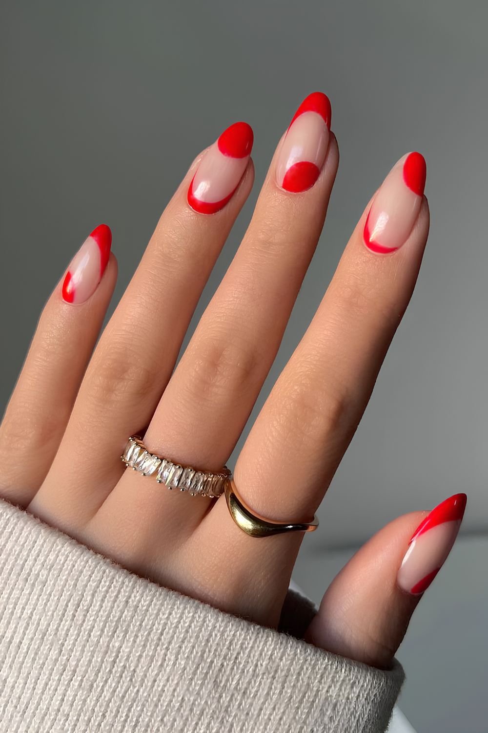 Neutral nails with abstract red swirls