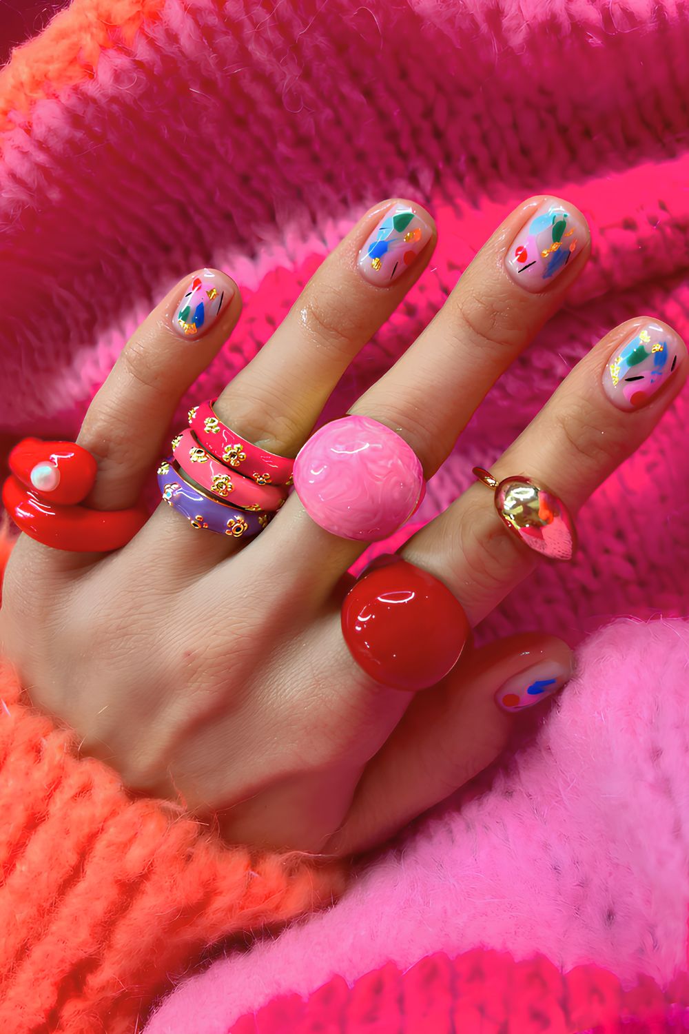 Neutral nails with colorful accents and gold foil