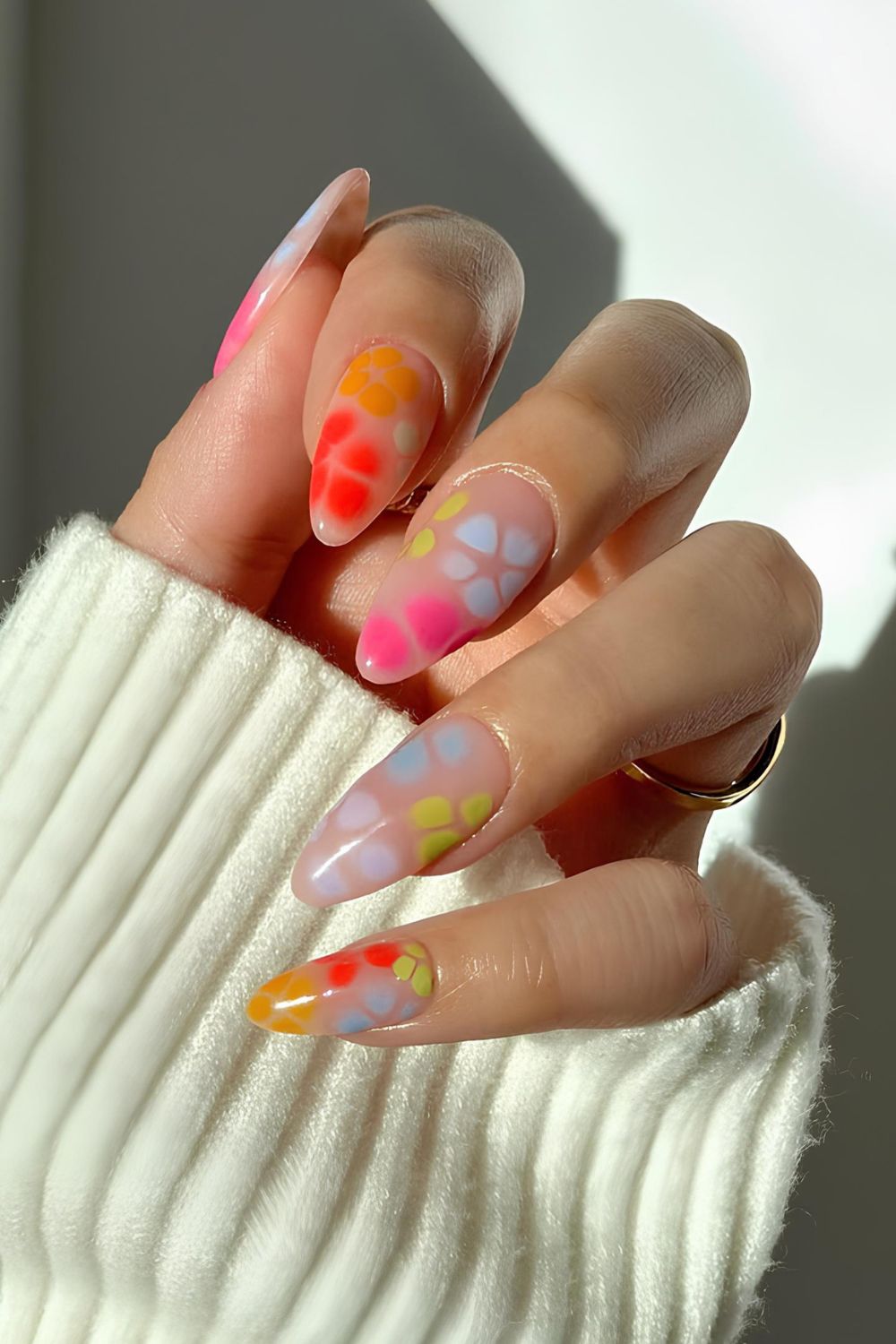 Neutral nails with colorful blooming flowers