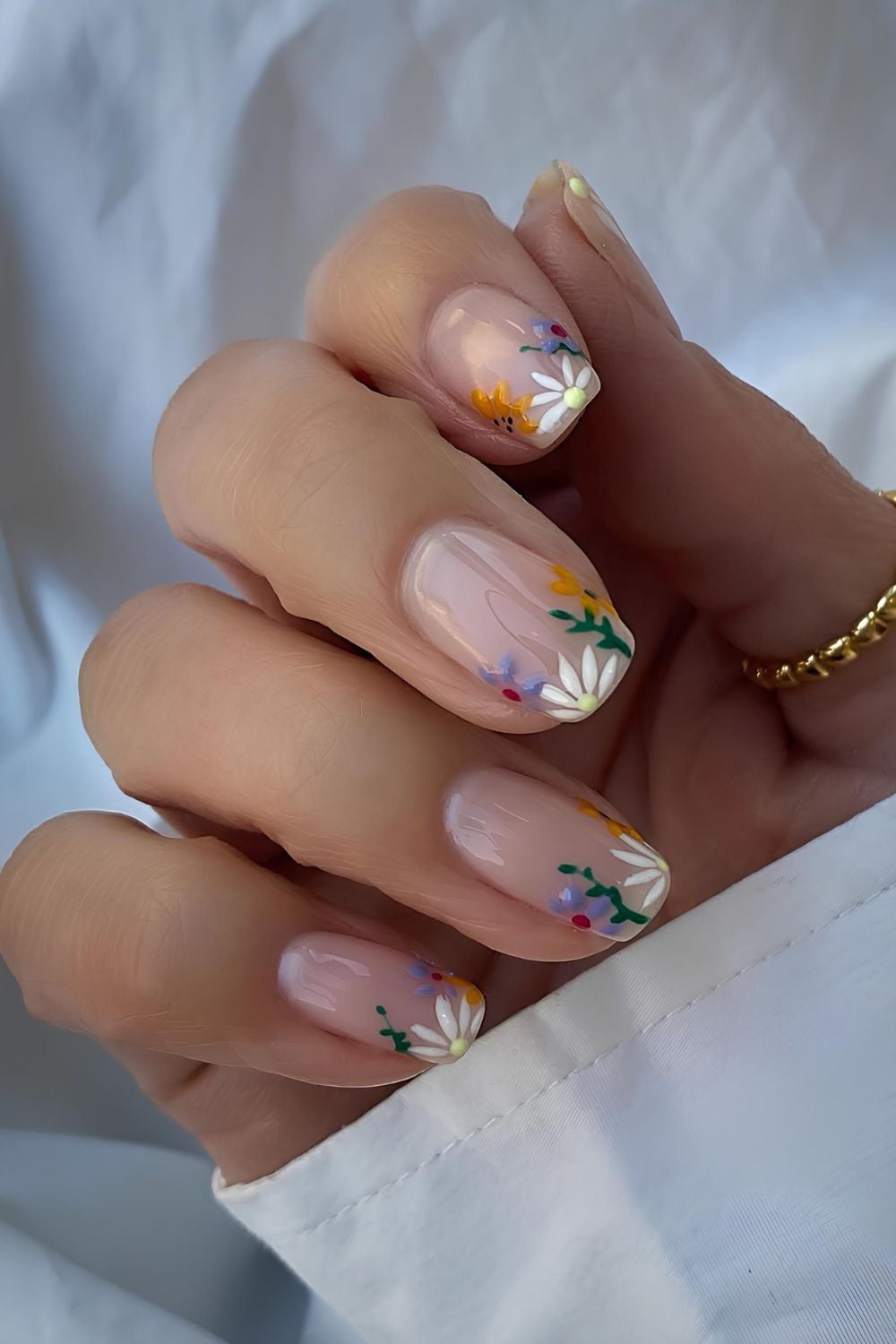 Neutral nails with colorful florals