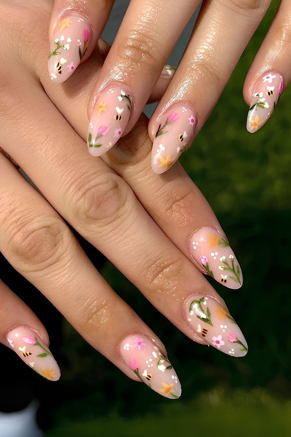 Neutral nails with colorful spring-themed art