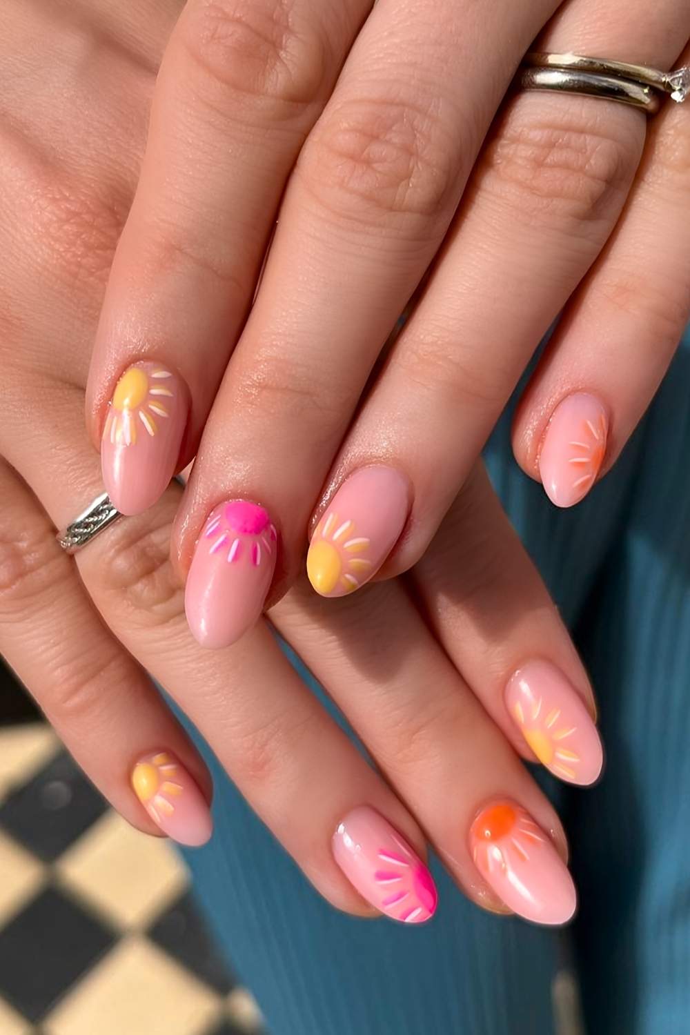 Neutral nails with colorful sun art