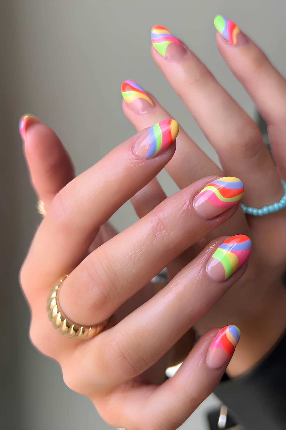 Neutral nails with colorful swirl design