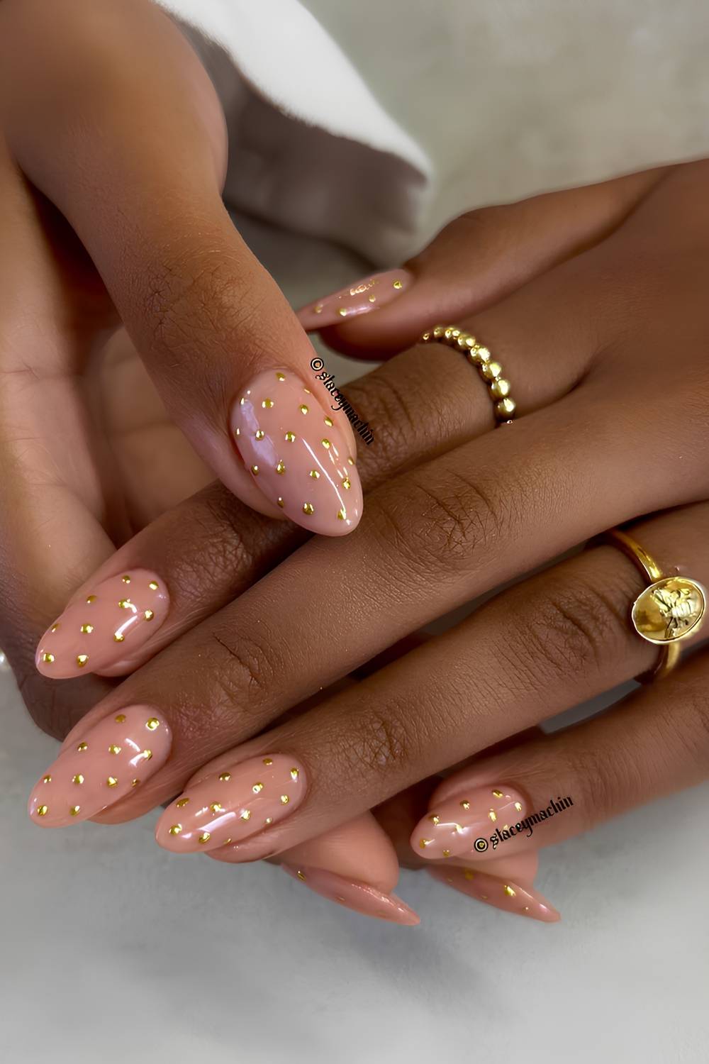 Neutral nails with gold polka dot art