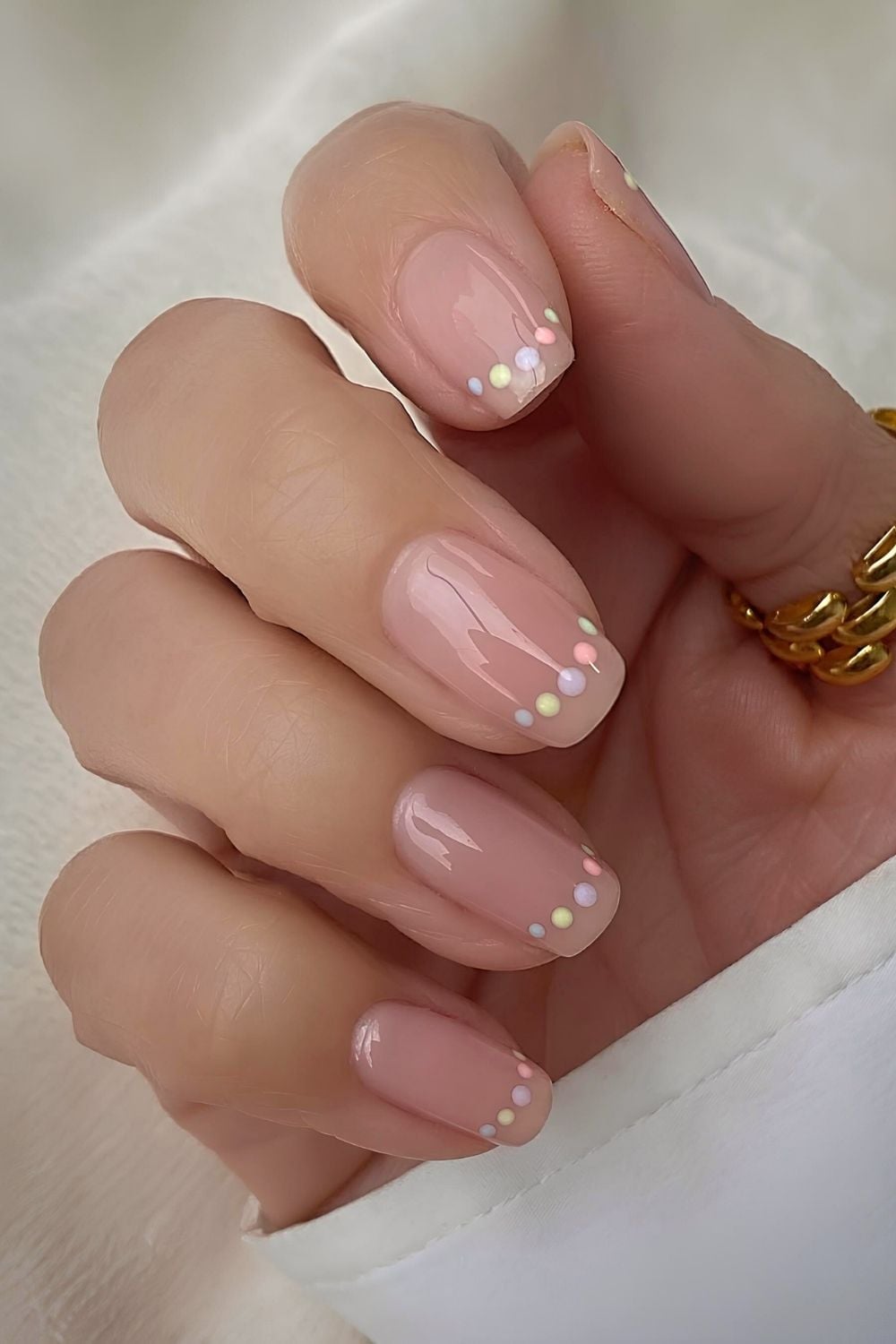 Neutral nails with pastel dotted outline