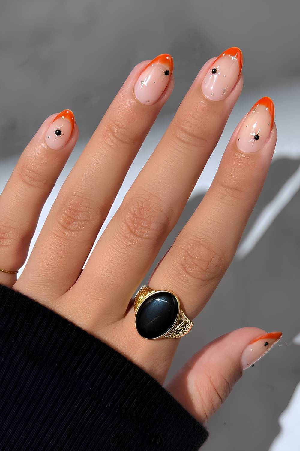Orange French nails with celestial art