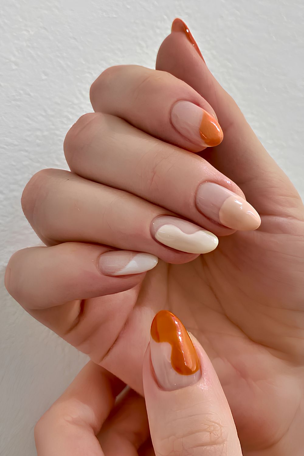 Orange and beige abstract French mani