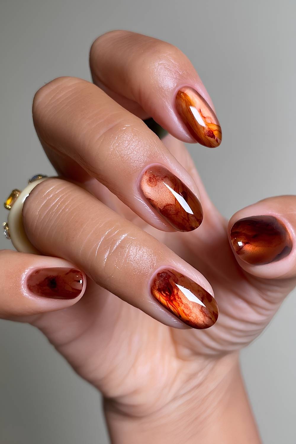 Orange and brown glass marble nails