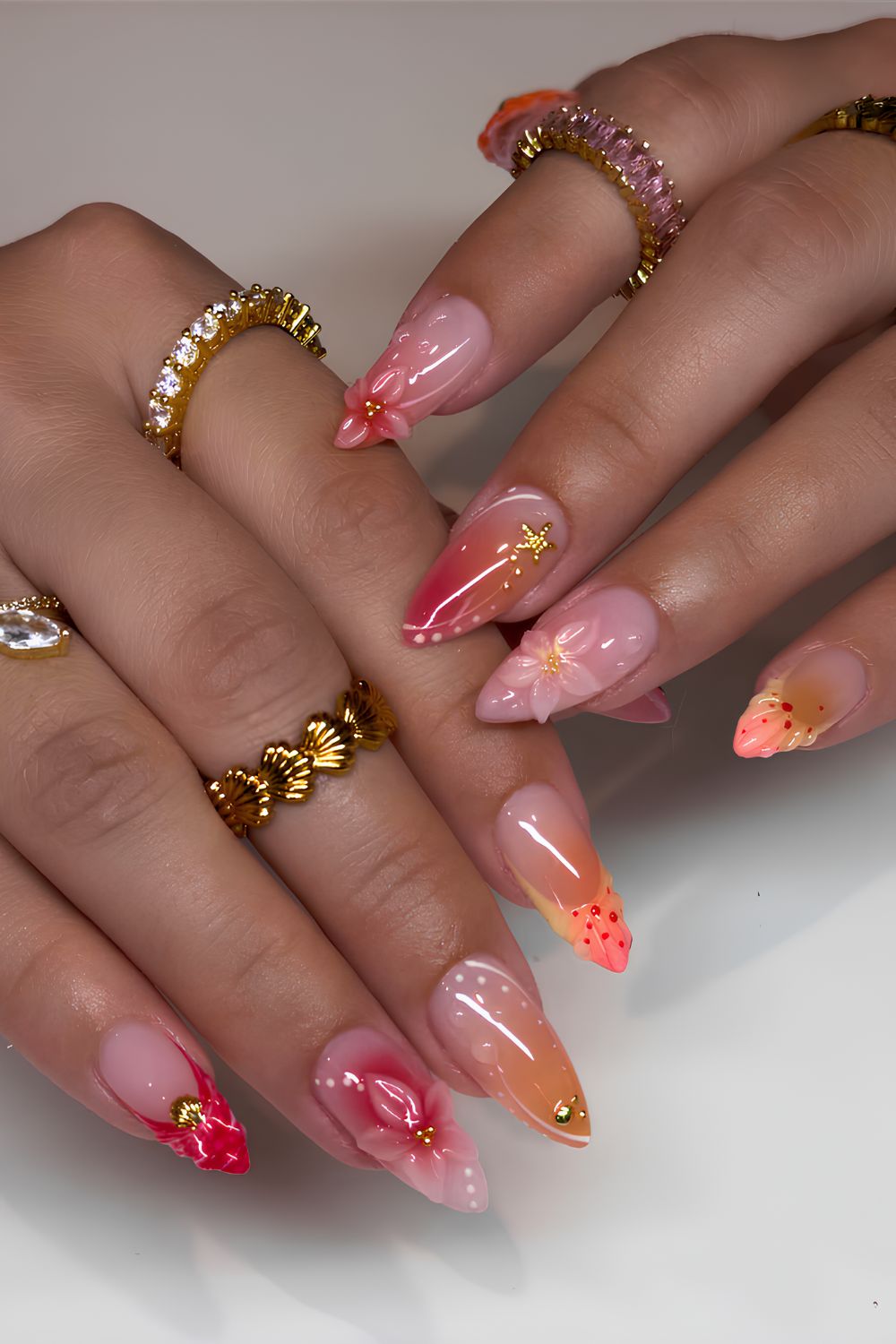 Orange and pink sunset inspired manicure