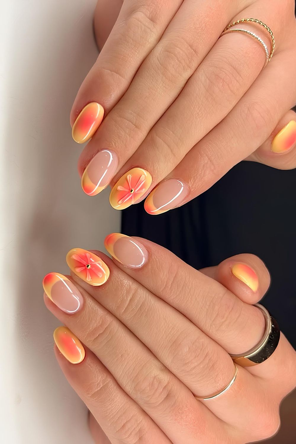 Orange and yellow French mani with aura effect and floral accent