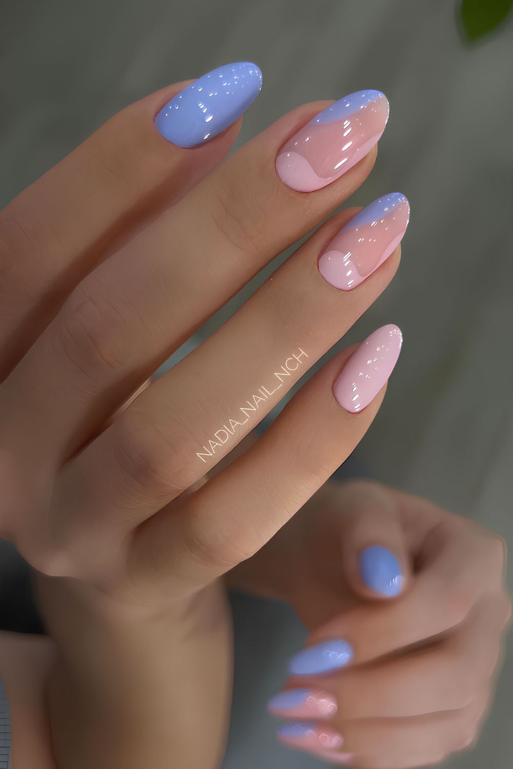 Pastel blue and pink nails with negative space