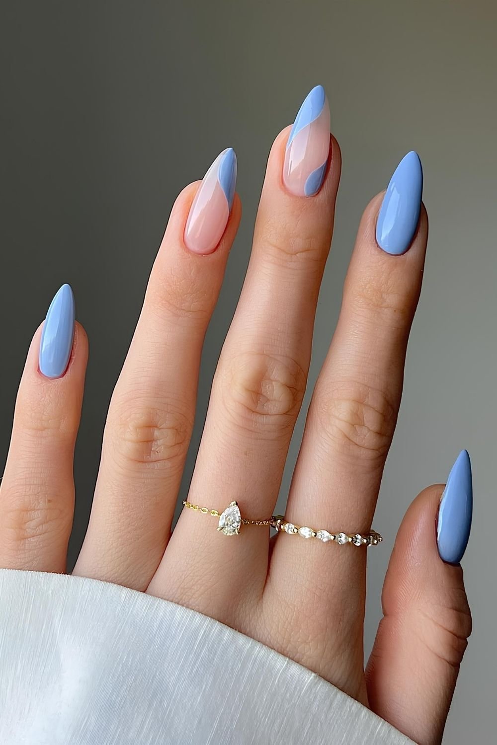 Pastel blue nails with swirls