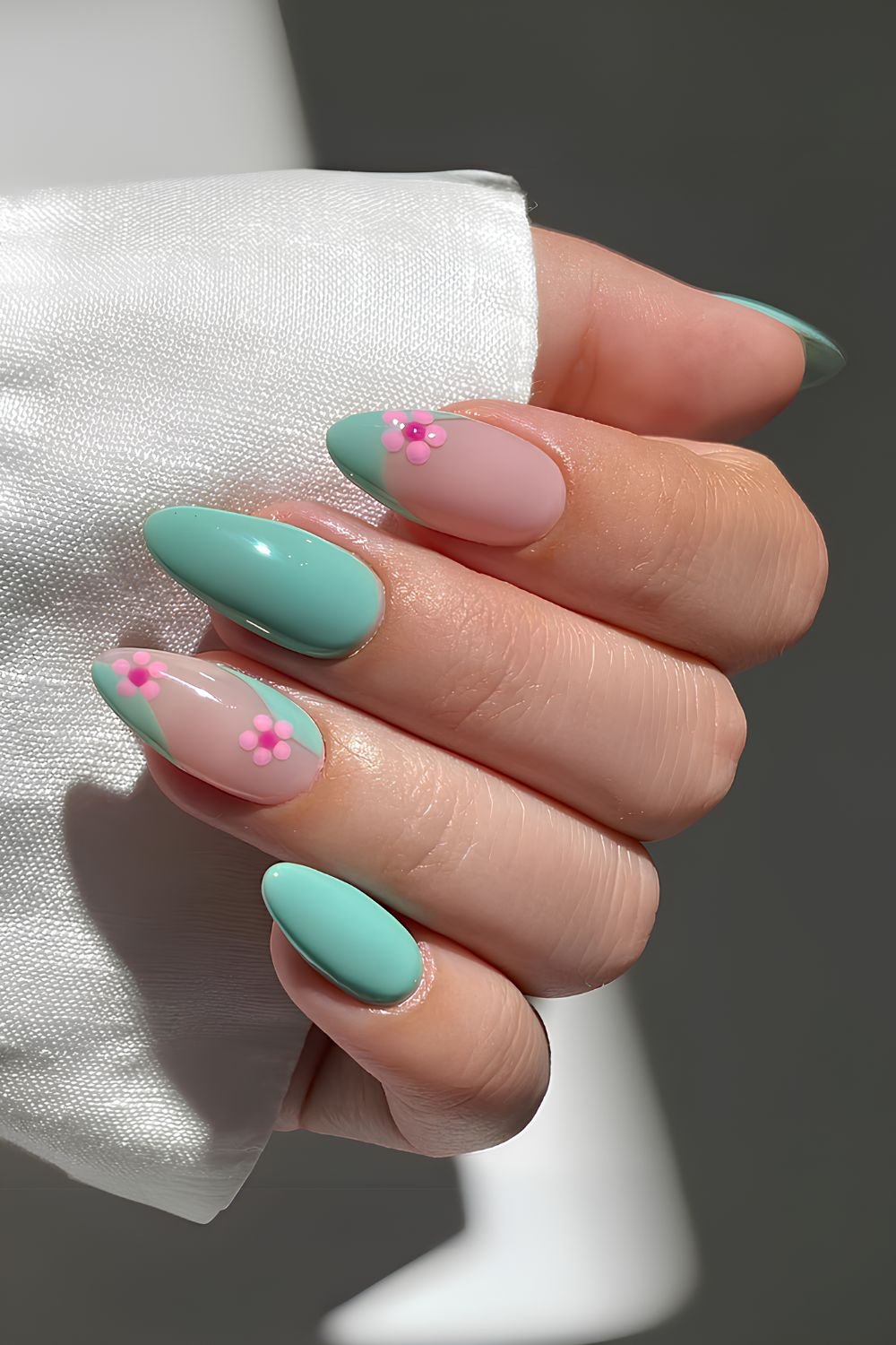 Pastel green nails with cherry blossom art