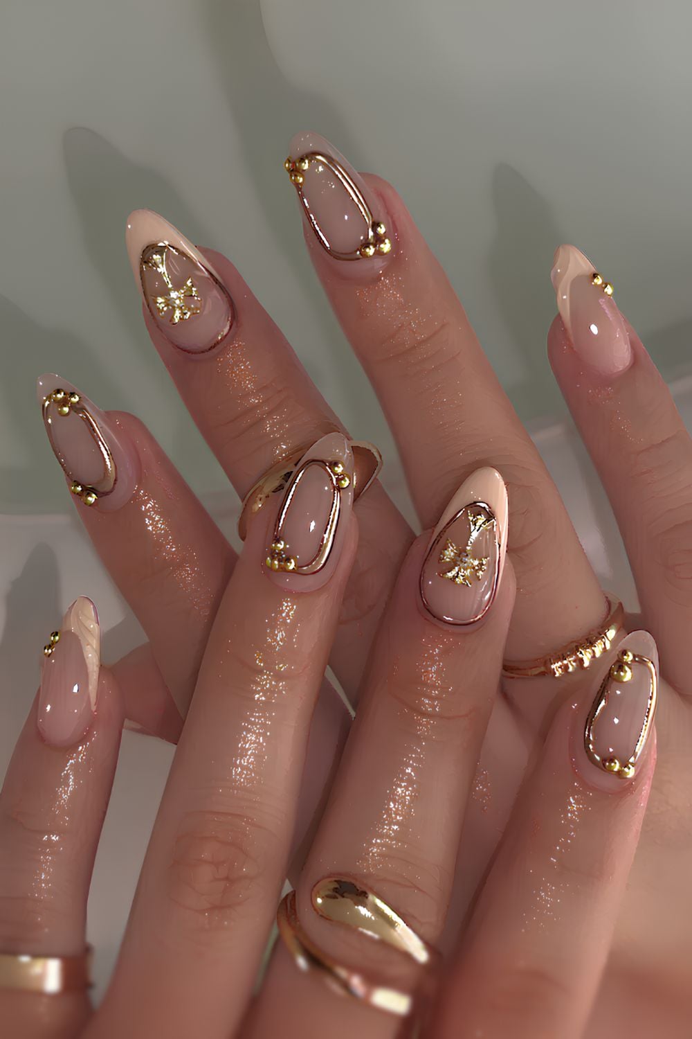 Pastel peach French mani with gold accents