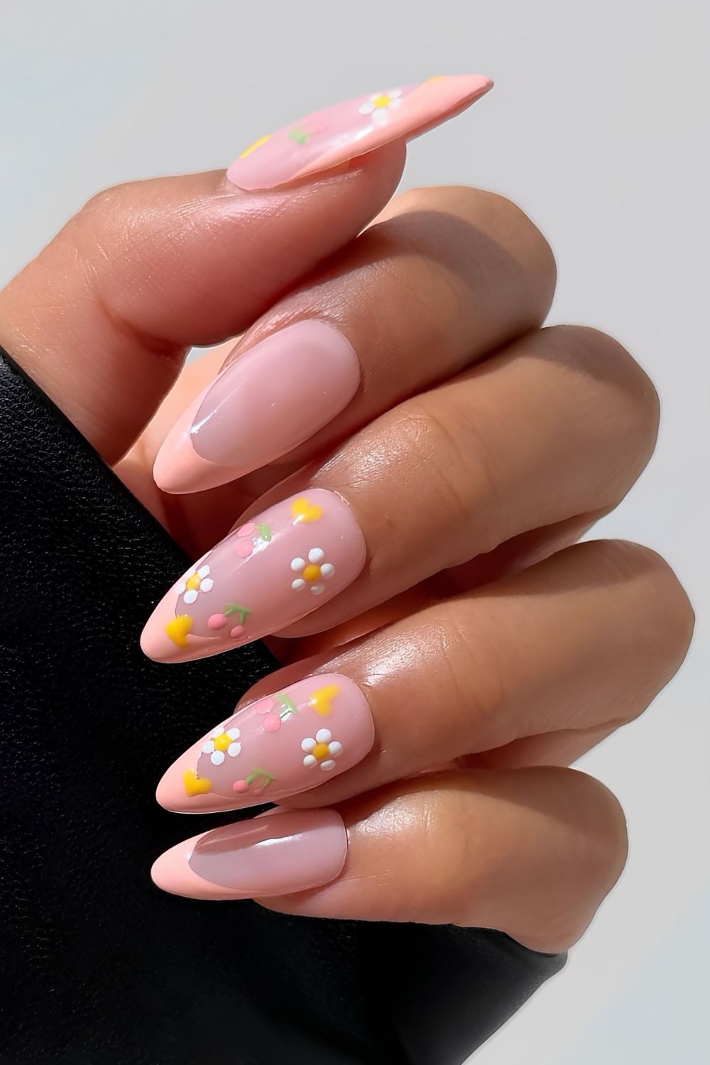 Pastel peach French mani with spring motives