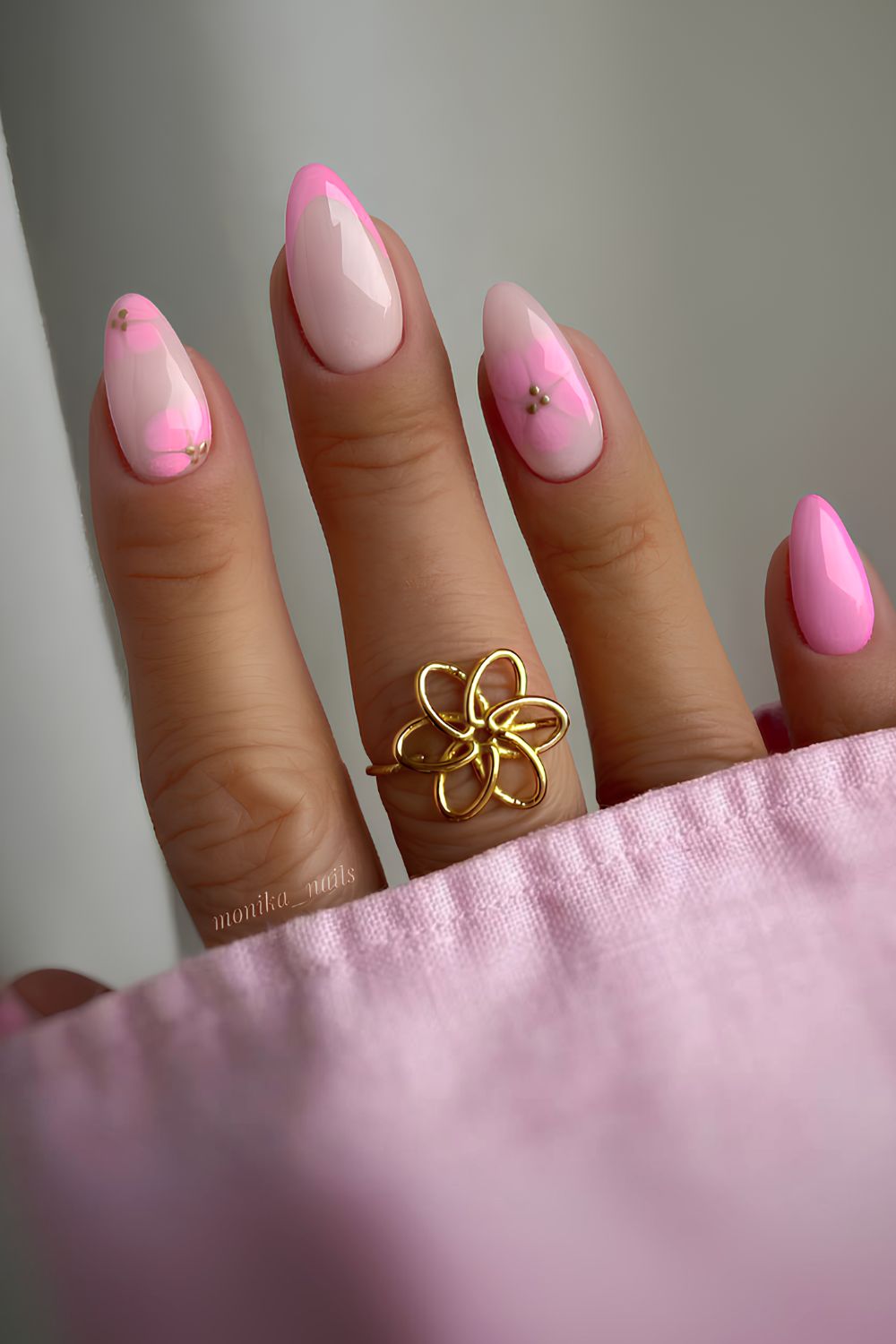 Pastel pink nails with blooming flower accents