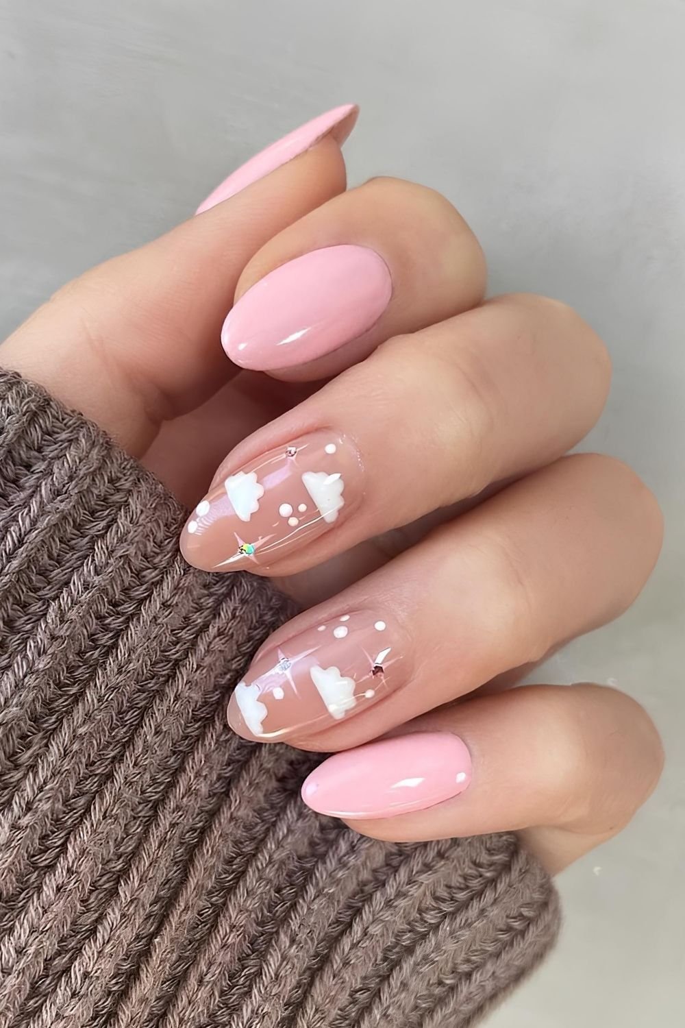 Pastel pink nails with clouds, dots and rhinestones