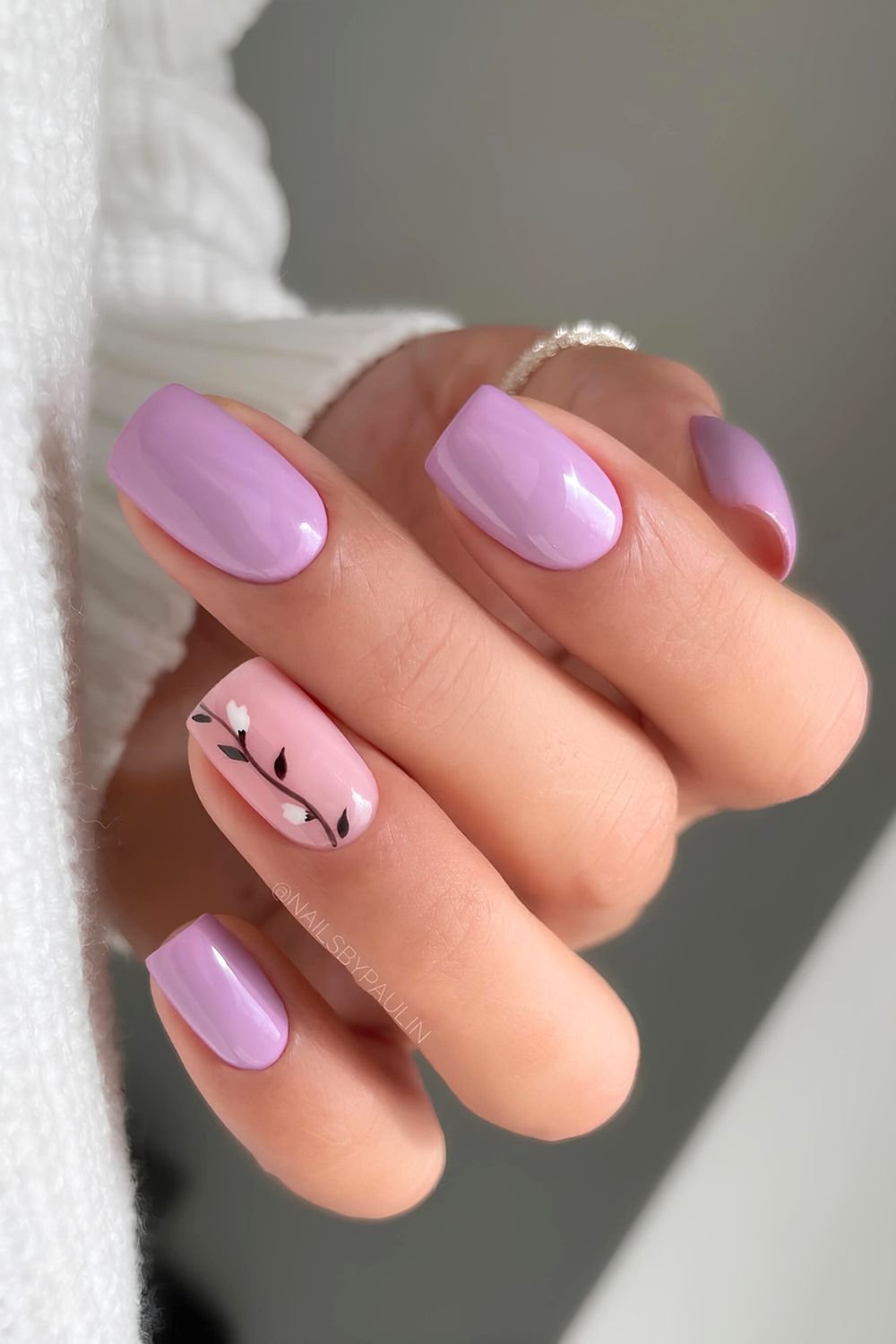 Pastel purple nails with floral accent