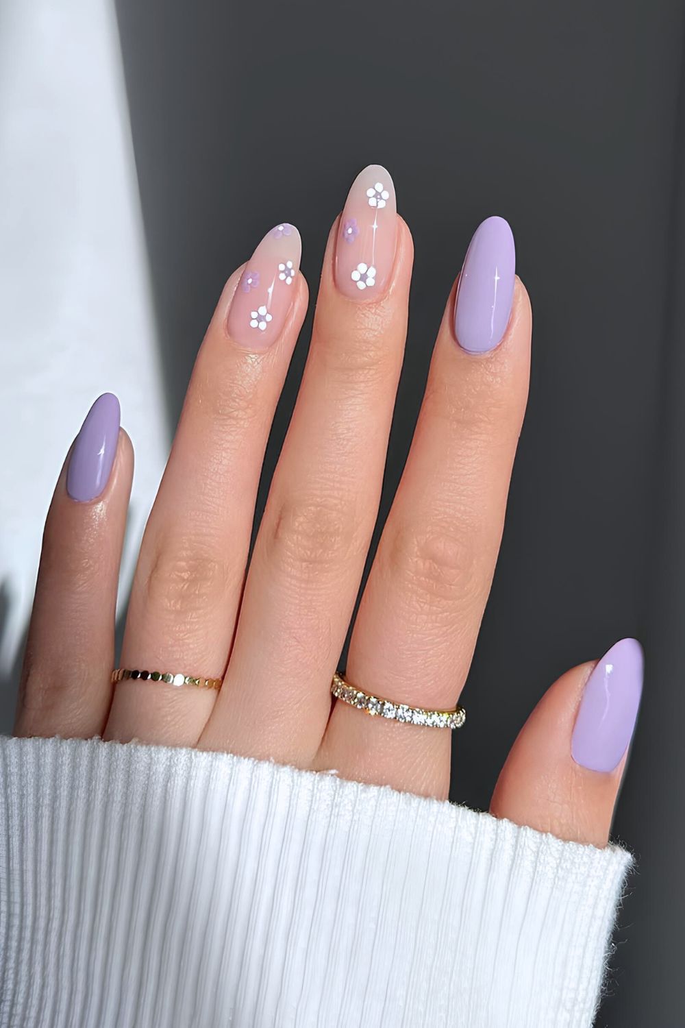 Pastel purple nails with floral accents