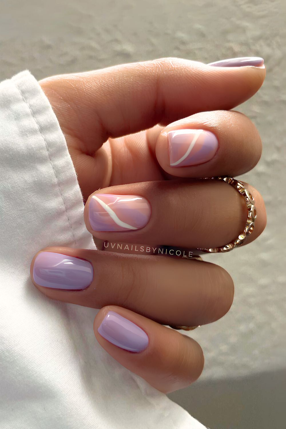 Pastel purple nails with swirls