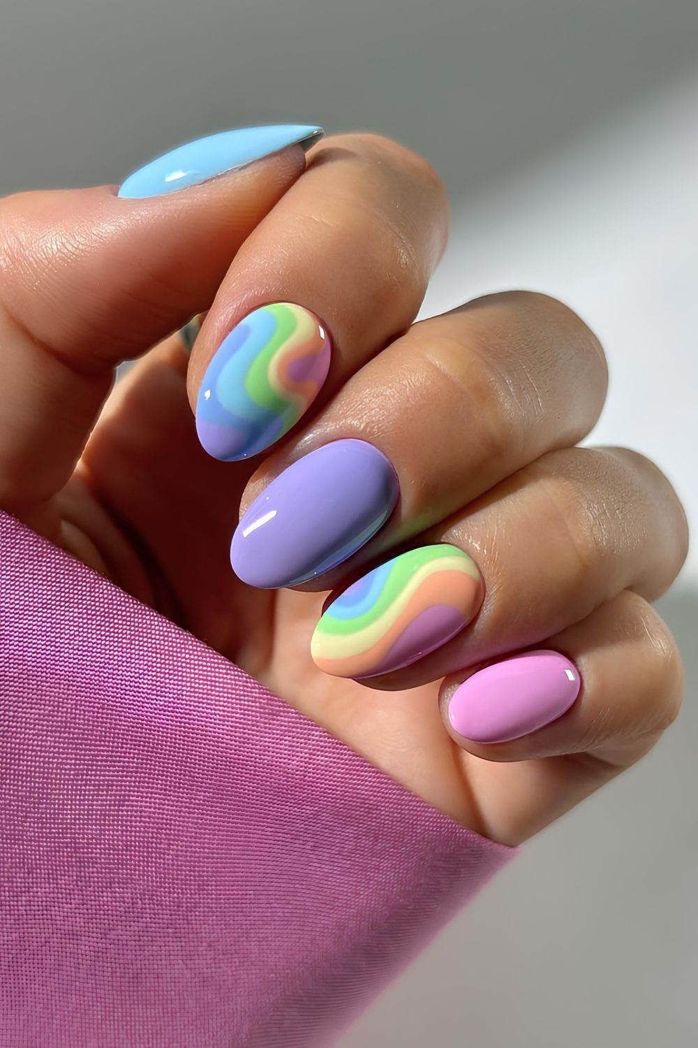 Pastel rainbow nails with swirls