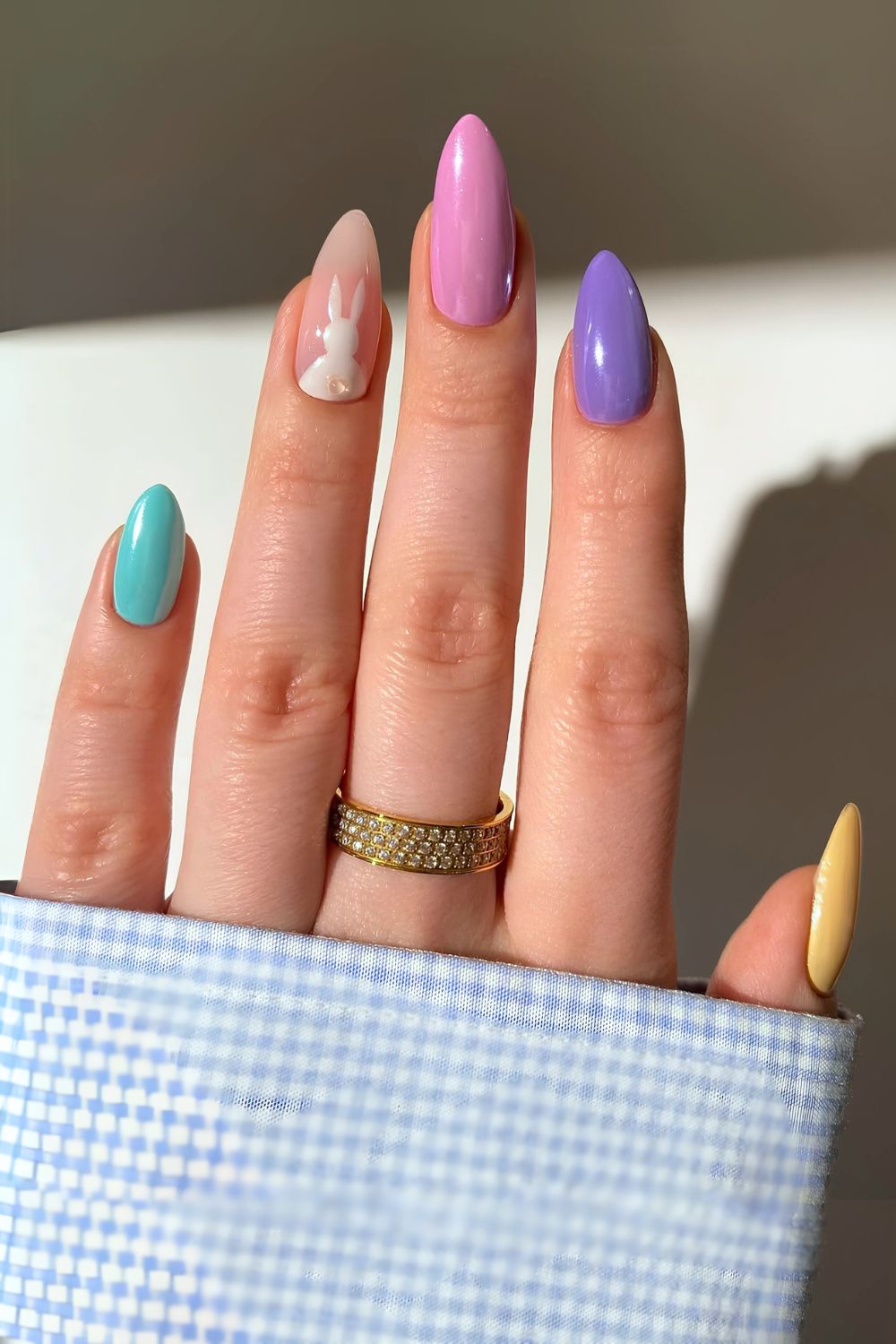 Pastel skittle nails with bunny tail accent