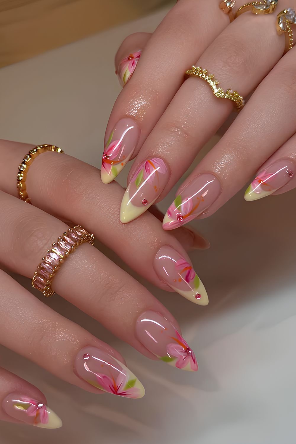 Pastel yellow French mani with pink flowers