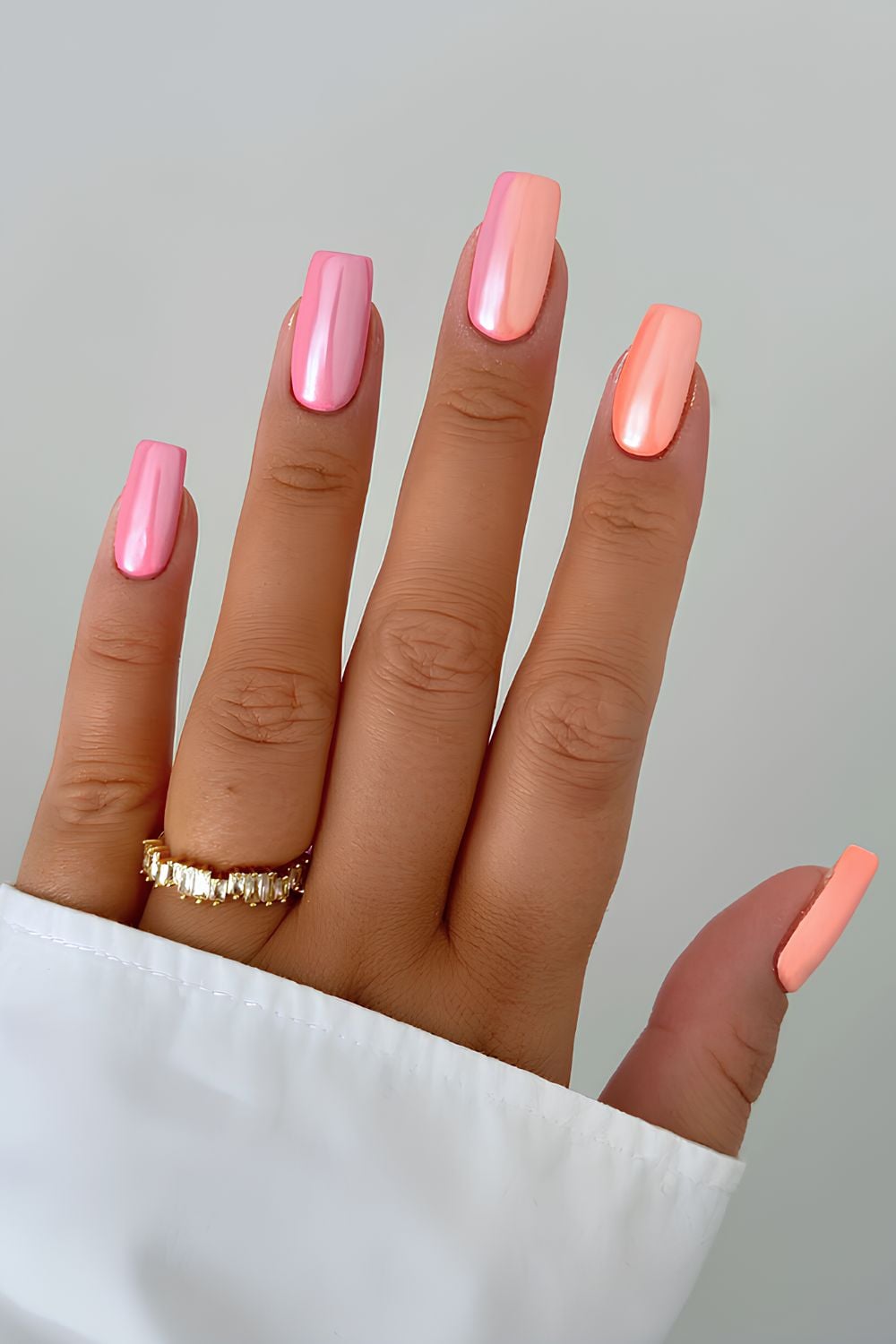 Peach and pink chrome nails