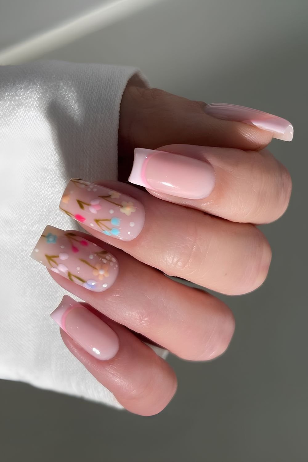 Pink French mani with colorful floral art