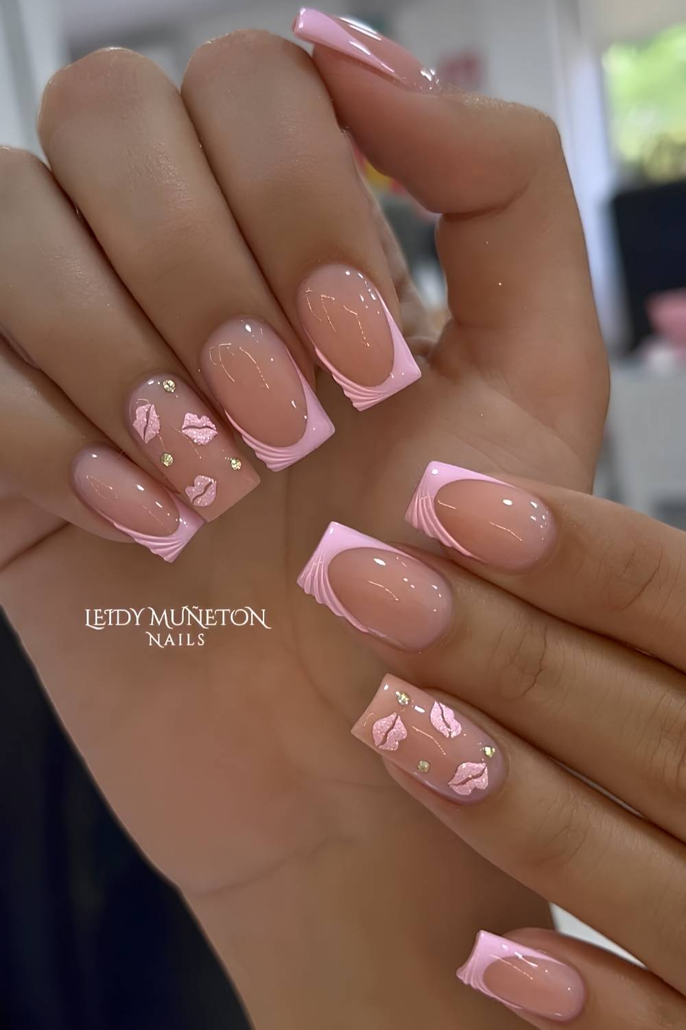 Pink French mani with glitter and kiss art
