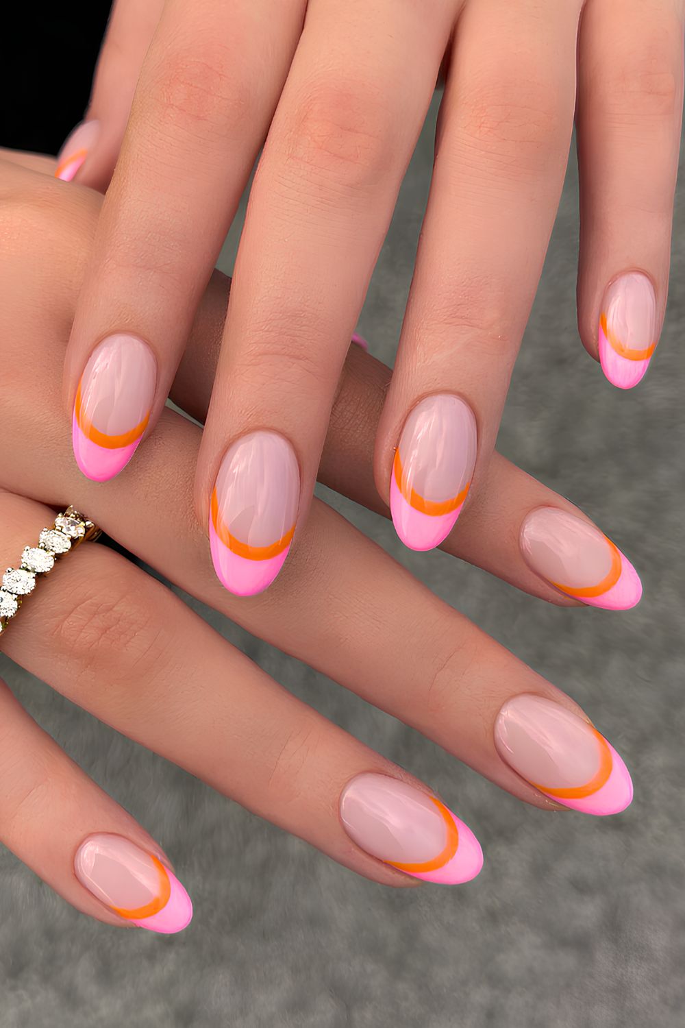 Pink French mani with orange outline