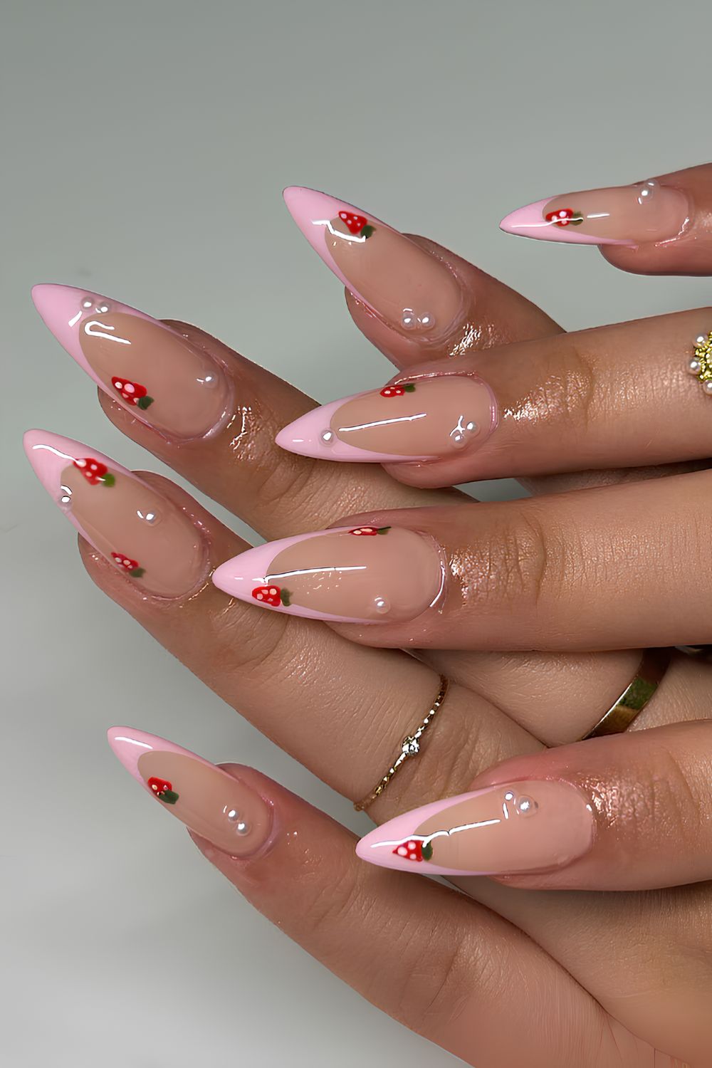 Pink French mani with strawberries and pearls