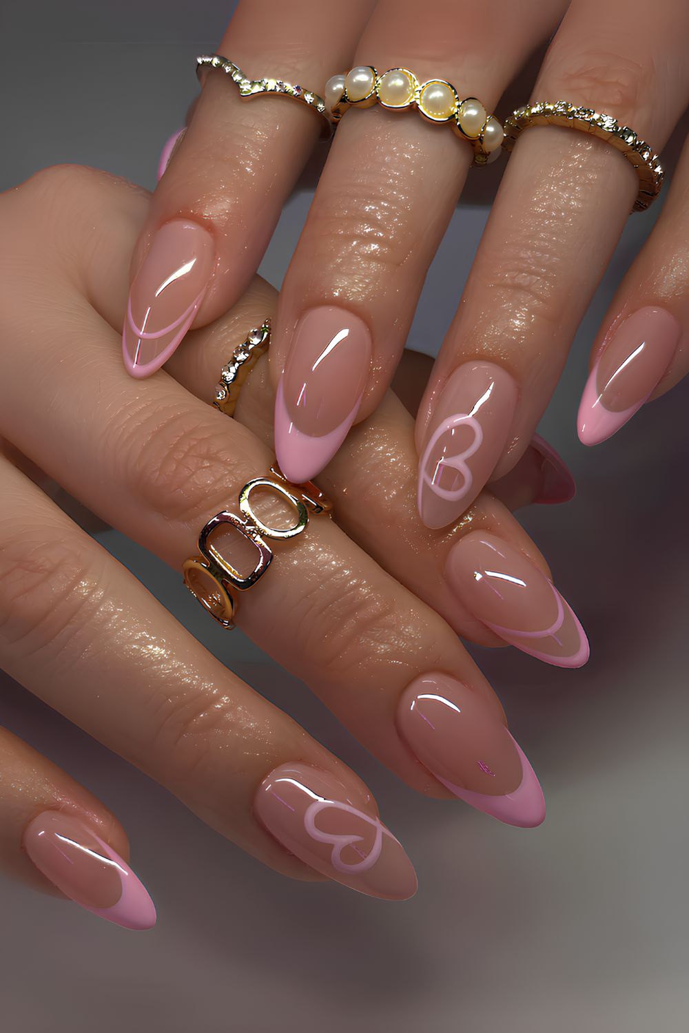 Pink French mani with swirly hearts