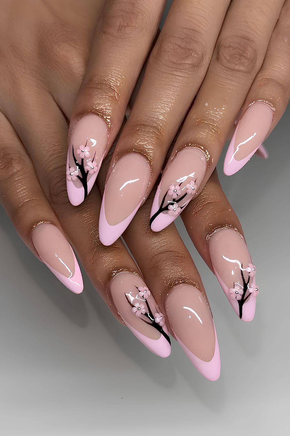 Pink French nails with 3D cherry blossom art