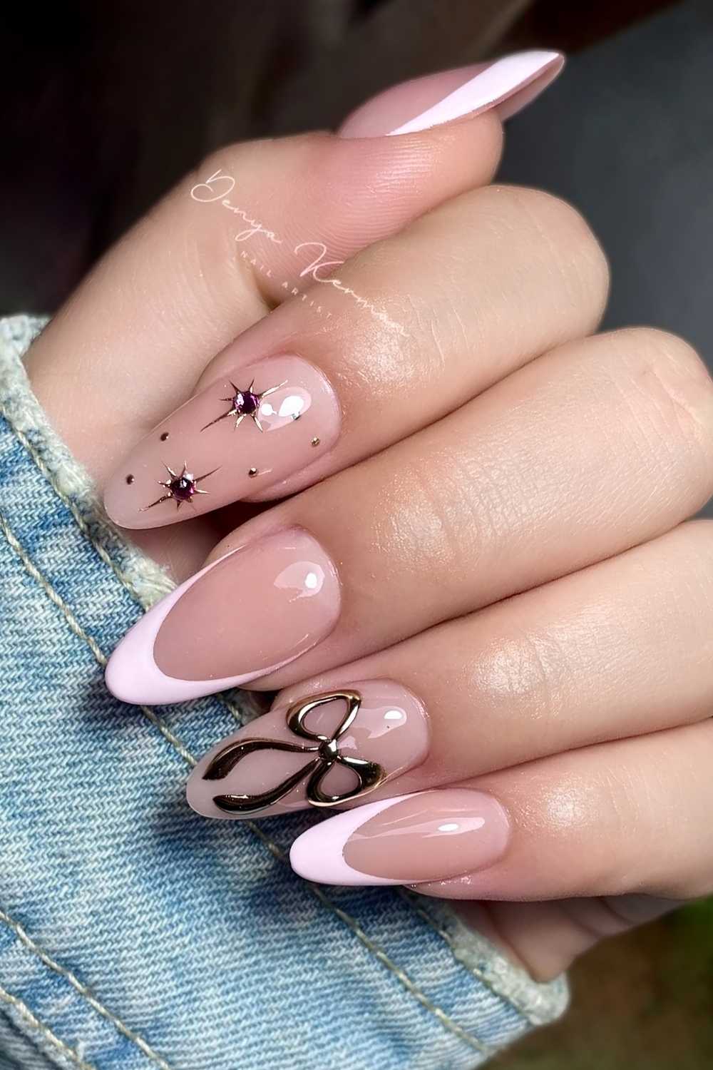 Pink French nails with silver stars and bows