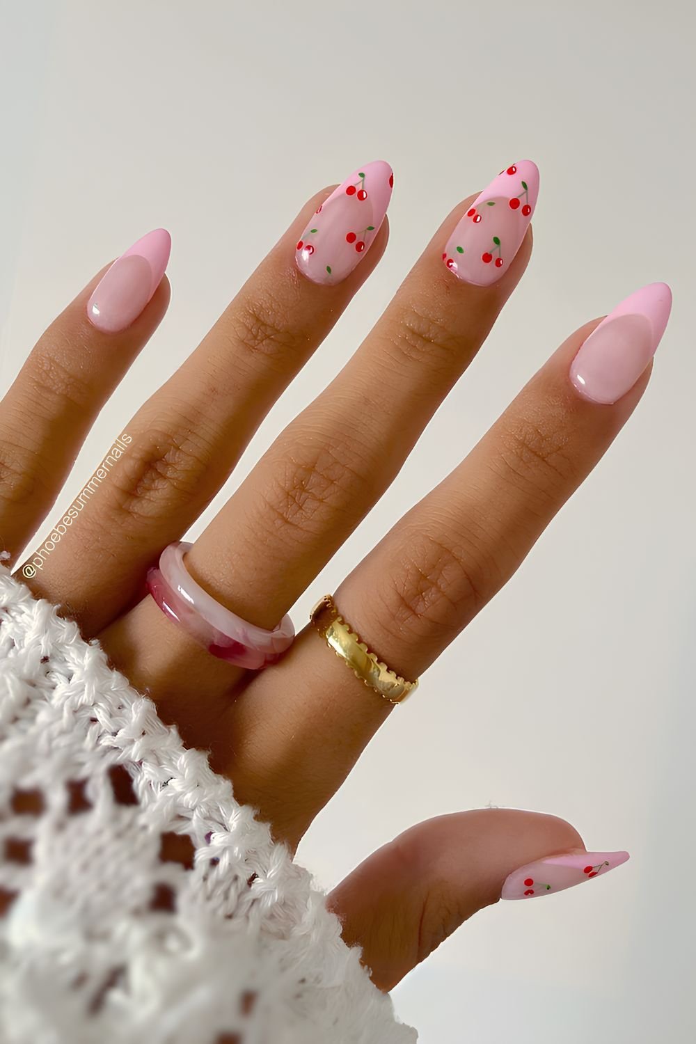 Pink French nails with tiny cherries